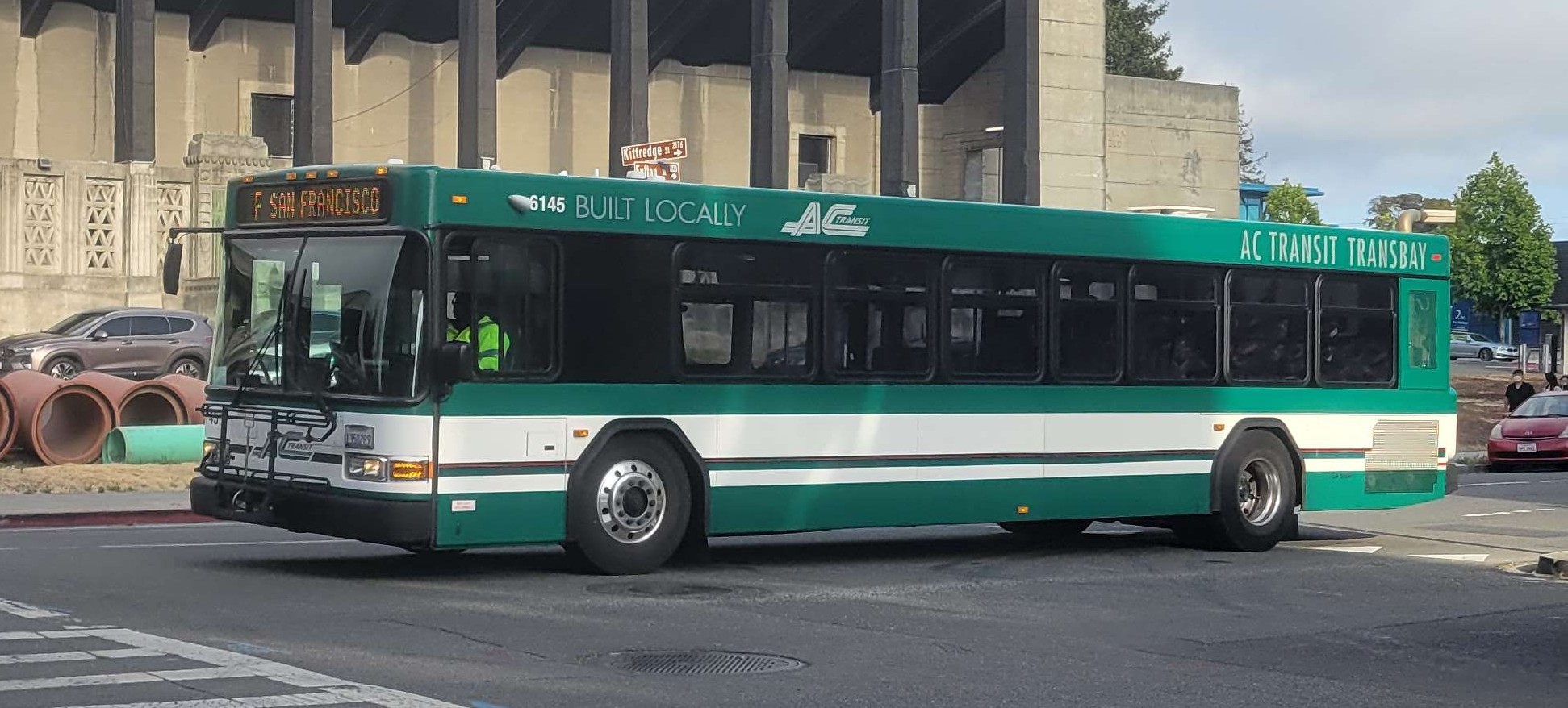 photo of a green AC transit Gillig bug
